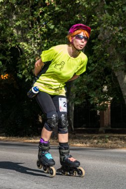 3 July 2022. Aranjuez, Spain. Vertical image of the marathon skating league held in the streets of Aranjuez by the river.