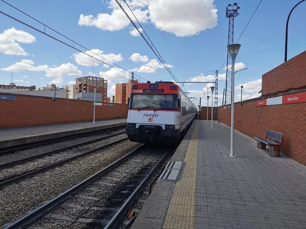 stock image Mostoles, Spain. May 7, 2023. Mstoles El Soto commuter train station, tracks, trains and train and parking lots on a sunny and calm day. 