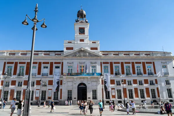 stock image Madrid, Spain. June 16, 2024. Main facade of the building of the Real Casa de Correos de Madrid, current seat of the government of the Community of Madrid, located in the Puerta de Sol square.