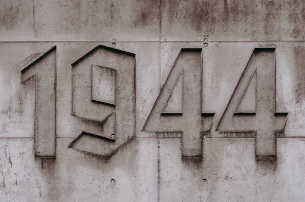 a number on a wall with a fire hydrant