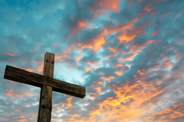 Religious Symbol of a Cross Overlooking a Breathtaking Sunset