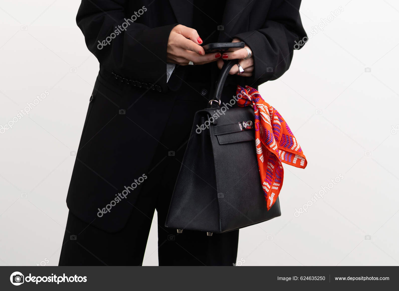 Paris, France - October, 3, 2021: woman wears handbag Hermes Kelly
