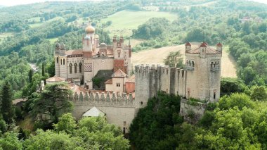 Aerial drone panoramic view of the Rocchetta Mattei castle in Italy on sunny summer day, view from above. High quality 4k footage