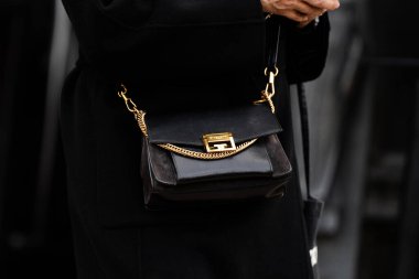 Milan, Italy - February, 22, 2024: woman wears Givenchy bag, fashion blogger outfit details, street style clipart