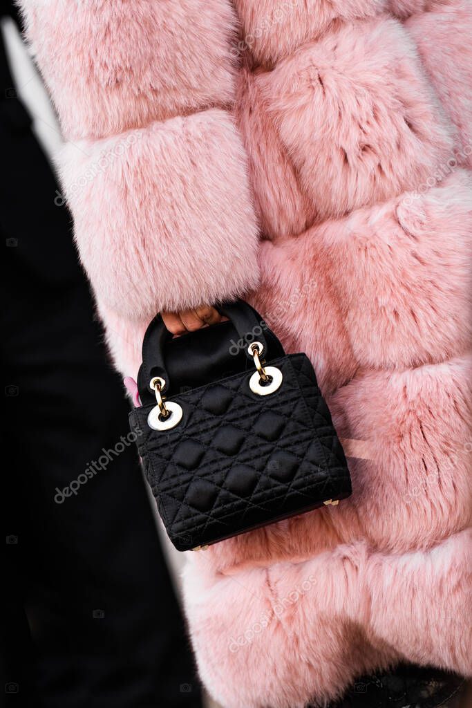 Milan, Italy - January, 24, 2024: woman wears Dior Lady bag, street style details, fashion outfit detail.