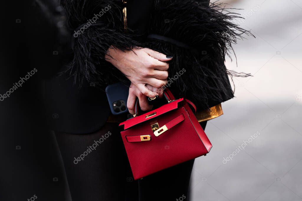 Paris, France - February, 29, 2024: woman wears Hermes Kelly bag, fashion blogger outfit details, street style.