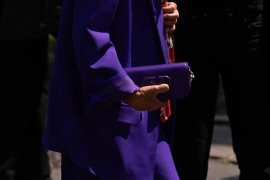 Milan, Italy - June, 16, 2023: woman wears Valentino bag, street style details, fashion outfit detail. clipart