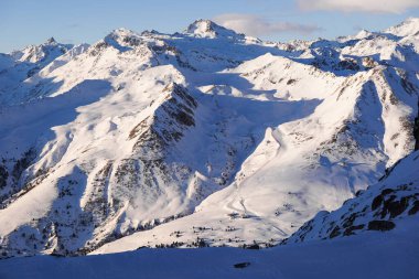 Breathtaking view of snow-covered mountain range, showcasing ski slopes and towering peaks, alpine ski resort, Ponte di Legno clipart