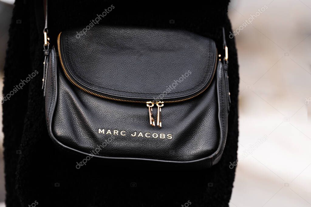Milan, Italy - February, 21, 2024: woman wears Marc Jacobs, fashion blogger outfit details, street style.