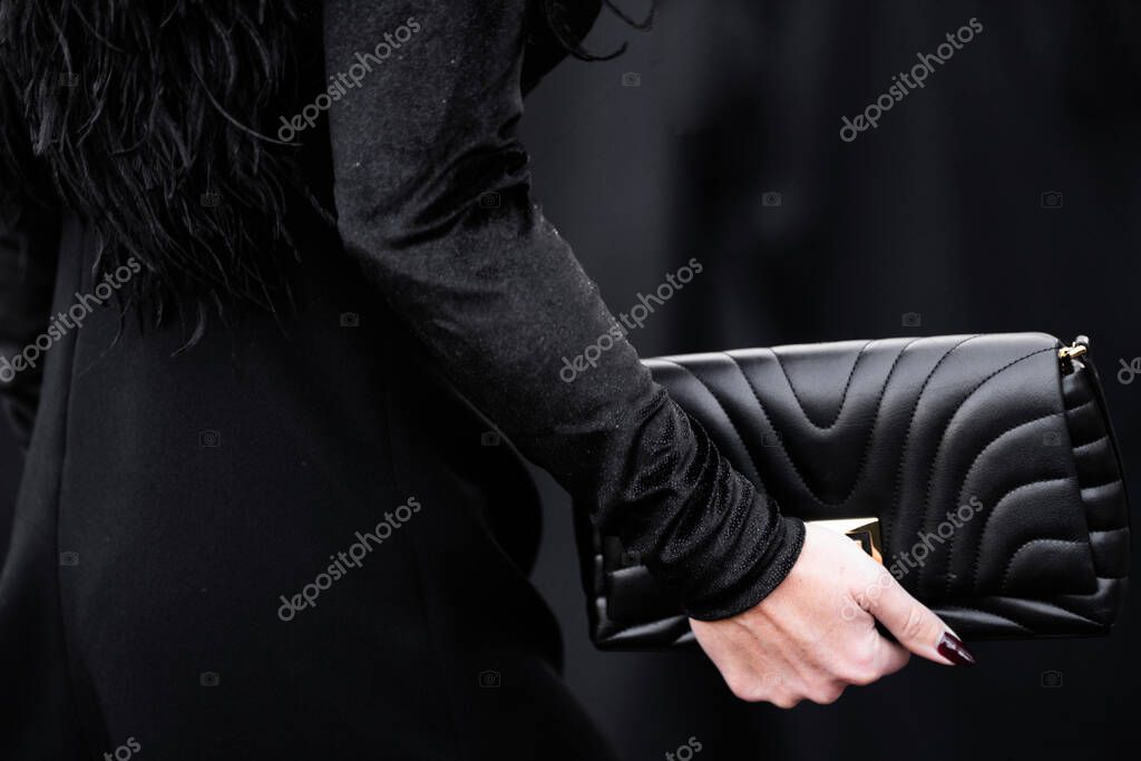 Milan, Italy - March, 25, 2024: Woman wears Givenchy soft small bag. Fashion outfit detail, street style
