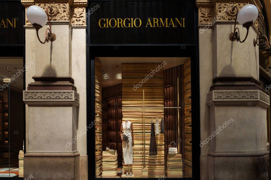 Milan, Italy - 24.04.2024: Giorgio Armani store showcase located at shopping gallery in the center of Milan, Galleria Vittorio Emanuele, vitrine of the woman clothes shop