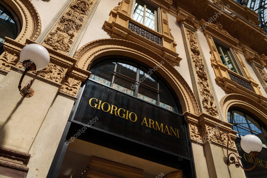 Milan, Italy - 24.04.2024: Giorgio Armani store showcase located at shopping gallery in the center of Milan, Galleria Vittorio Emanuele, vitrine of the woman clothes shop