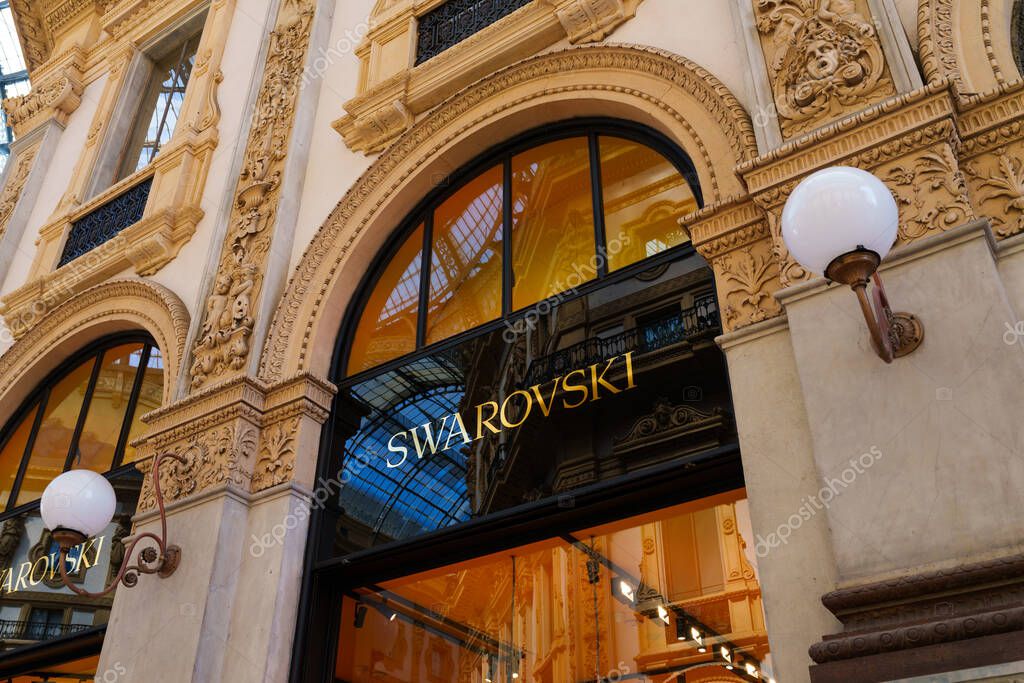 Milan, Italy - 24.04.2024: Swarovski store showcase located at shopping gallery in the center of Milan, Galleria Vittorio Emanuele, vitrine of the woman clothes shop