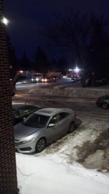 Snow Blower Removing Snow From city road ,  a view from Regina saskatchewan