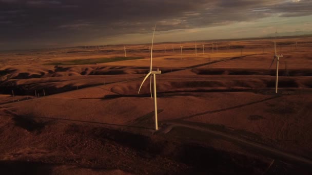 Aerial Cinematic Sunset Wind Farm Colourful Sky Producing Sustainable Energy — Wideo stockowe