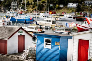 Dildo Newfoundland Canada, September 26 2022: Harbour view of a small tourist destination with vessels and boat sheds on the East Coast.