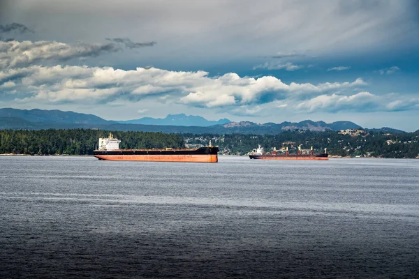 Empty freighters and container ships anchored off the coast of Vancouver Island awaiting to be loaded during the BC Port Workers Strike at Nanaimo BC