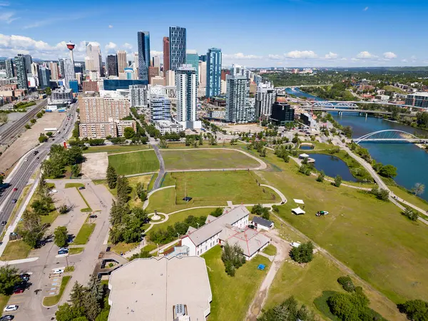 stock image Calgary Alberta Canada, June 20 2024: Fort Calgary overlooking the downtown skyline with Bow river and world attractions with pathways.