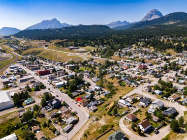 Coleman Alberta Canada, July 25 2024: Aerial small mountain town overlooking the Crowsnest Pass historical coal mining town and trailer parks. clipart