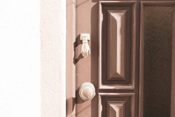 Hand as door handle on door