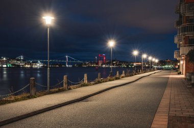 GOTHENBURG, SWEDEN - OCTOBER 3, 2019: Pier with lanterns at Gothenburg harbor clipart