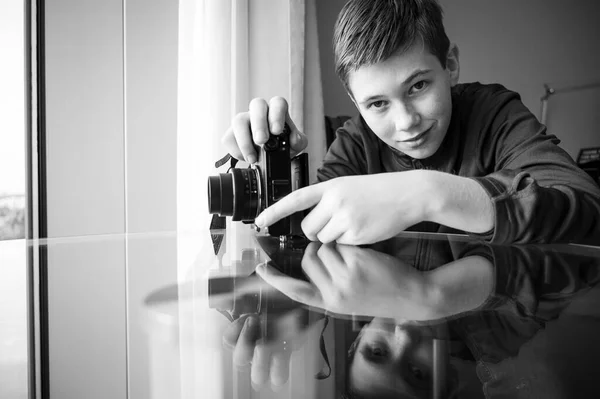 stock image Reflection of boy with a camera in black and white 