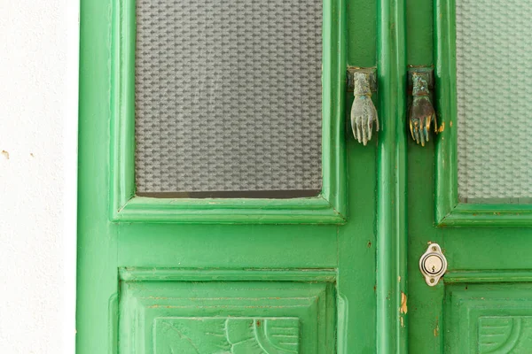Hand as door handle on door