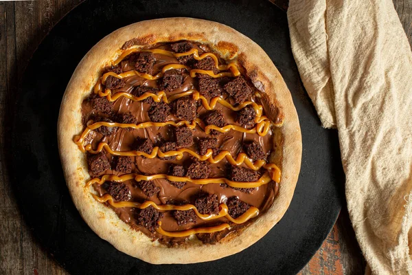 chocolate pizza with brownie. delicious chocolate brownie and caramel pizza. Brazilian pizza
