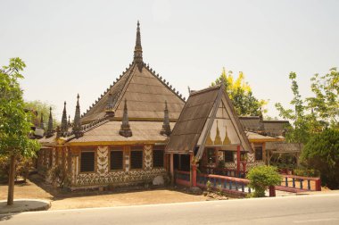 Traditional ancient wooden sermon hall at Wat Somdet, a historic site in Amphoe Sangkhlaburi, Kanchanaburi Province , Middle of Thailand. A combination of Thai-Raman and Myanmar art. 