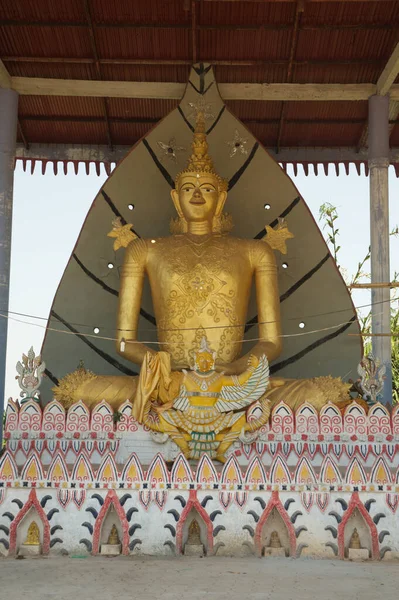 A large indoor golden sitting Buddha image at Wat Somdet in Amphoe Sangkhlaburi. A historic site in Kanchanaburi Province ,Middle of Thailand. A combination of Thai-Raman and Myanmar art.