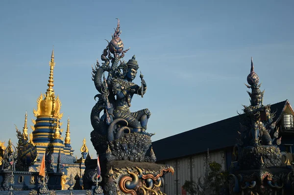 Statues of angels guarding the beautiful place in the style of applied Thai art that are very detailed and exquisite. It is unique in front of the pagoda at Wat Rong Suea Ten temple. Located at Chiang Rai Province inThailand.