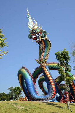 This Naga body is called Grandpa Phaya Sri Phet Khiri Mahamuni Srisutthonakarat Enshrined at Tham Chaeng Temple, it is a large and colorful Naga figure. It has become a new landmark tourist attraction in Phetchabuei Province , Thailand.