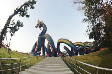 This Naga body is called Grandpa Phaya Sri Phet Khiri Mahamuni Srisutthonakarat Enshrined at Tham Chaeng Temple, it is a large and colorful Naga figure. It has become a new landmark tourist attraction in Phetchabuei Province , Thailand.