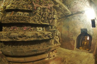 The balcony is curved like a tunnel. It is nearly 100 meters long on each side and decorated with high relief paintings related to the Buddha Jataka at Wat Shitetaung praya. Located at Mrauk-U , Myanmar. clipart