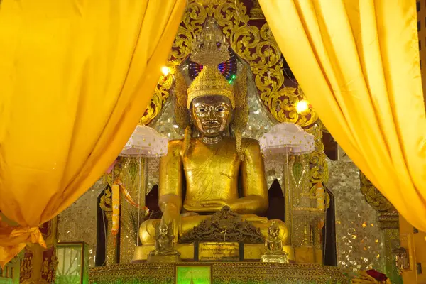 stock image A large golden seated Buddha image is the main Buddha image in the Mahamuni Phrya Temple Church. It is located on the Rakhine State, Myanmar.