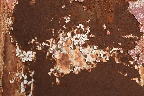 stock image Texture or background of the metal wall is painted red with rust. and has corrosion, damage, chipping and peeling.