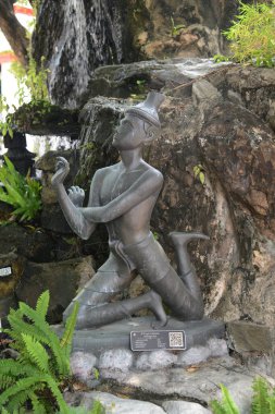 Statue of a hermit performing a massage therapy pose at Wat Phra Chetuphon Wimon Mangkhalaram or Wat Pho. This place is most famous forThai traditional massage. Located at Bangkok capital city in Thailand. clipart