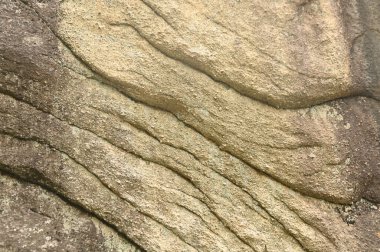 Kum taşı dokusunun yakın plan görüntüsü.