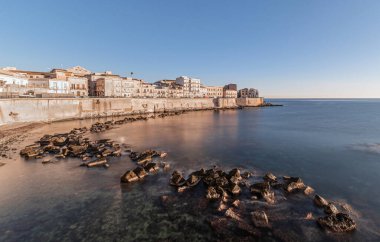 Syracuse Sicily. The dawn of a new day on the beautiful seafront of Ortigia
