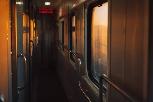 Empty compartment corridor of train carriage.