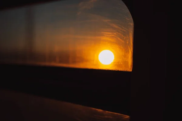 Sun at sunset through the car window.