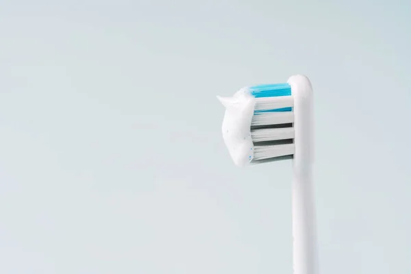 Electric Toothbrush Head Toothpaste Blue Background — Stock Photo, Image