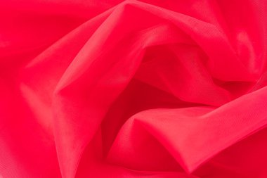 Kırmızı buruşuk tülün arka planı.