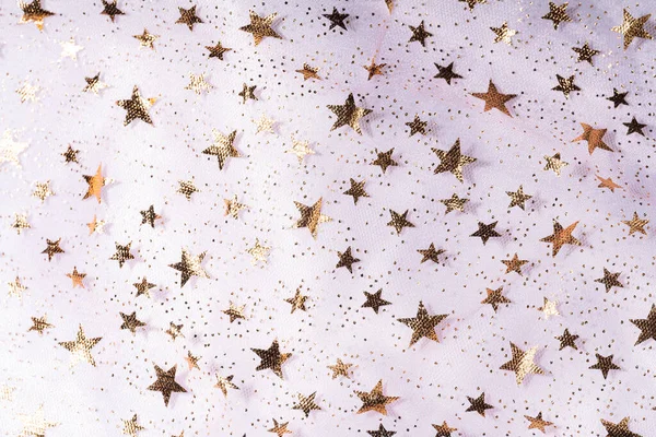 stock image Background of transparent tulle with stars on white tulle.