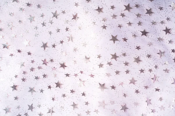 Background of transparent tulle with stars on white tulle.