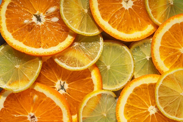 Kerek Szeletelt Citrusfélék Háttere Narancssárga Citrom — Stock Fotó