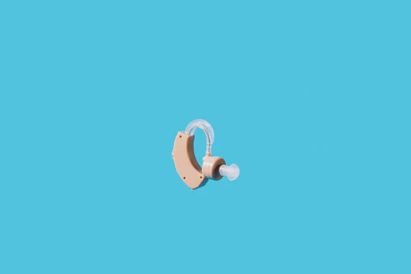 Hearing Aid Flies Blue Background — Stock Photo, Image