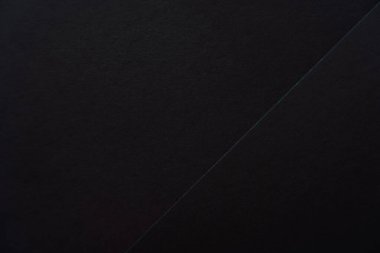 Koyu siyah kağıdın yüzeyinde köşegenler var. Yüksek kalite fotoğraf