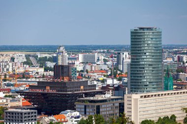 Bratislava, Slovakia - June 19 2018: The National Bank of Slovakia (the tallest skyscraper in the capital) next to the Slovak Radio Building shaped like an upside down pyramid.