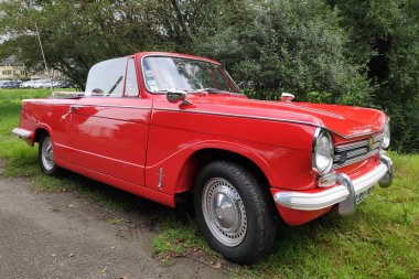 Guerlescin, France - September 19 2021: The Triumph Herald is a small two-door car produced in 1959 through to 1971. The body design was by the Italian stylist Giovanni Michelotti.